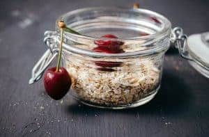 oatmeal and cherries in a jar