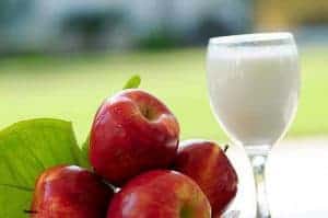 Red apples and milk in a glass