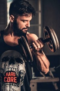 a man exercising with dumbbells