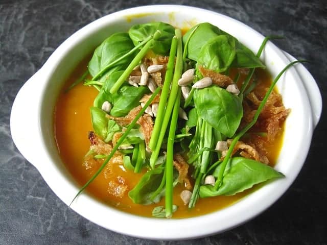 dietetic pumpkin cream soup with fresh herbs