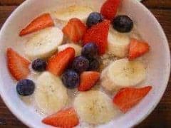 with bananas, blueberries and strawberries