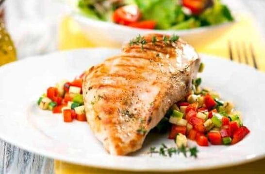 grilled fish with vegetables on a plate