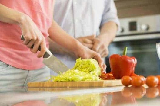 woman slices cabbage