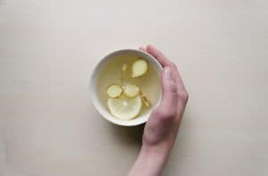 A cup of tea with lemon and ginger