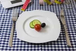Cucumber, tomato and olive slices on a plate