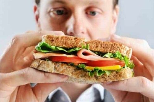 man eats a sandwich