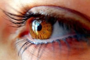 the eye of a woman with long lashes