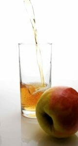 Apple and apple cider vinegar in a glass