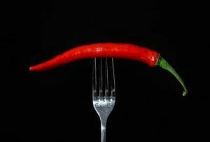 chili peppers on a fork