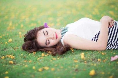 woman sleeping on the grass