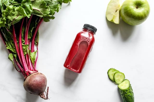 healthy food: beetroot juice, beets, apples, cucumbers