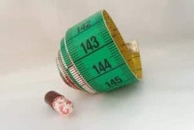 rolled up measure and tablet
