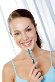 smiling woman with a toothbrush