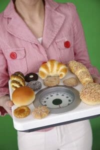 woman carries biscuits on the scale