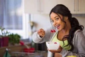 woman eats fruit