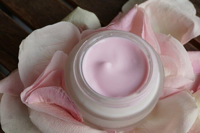 Face cream, rose petals