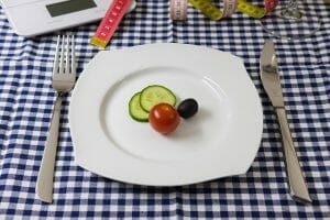 vegetables on a plate, knife and fork