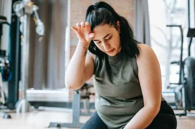 overweight woman tired after a workout