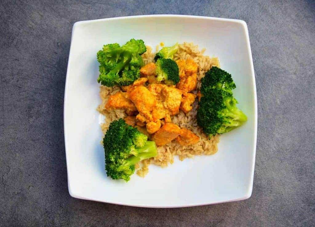  rice with chicken and broccoli on a plate