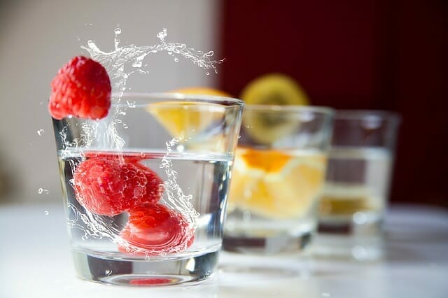  glasses of water and fruit