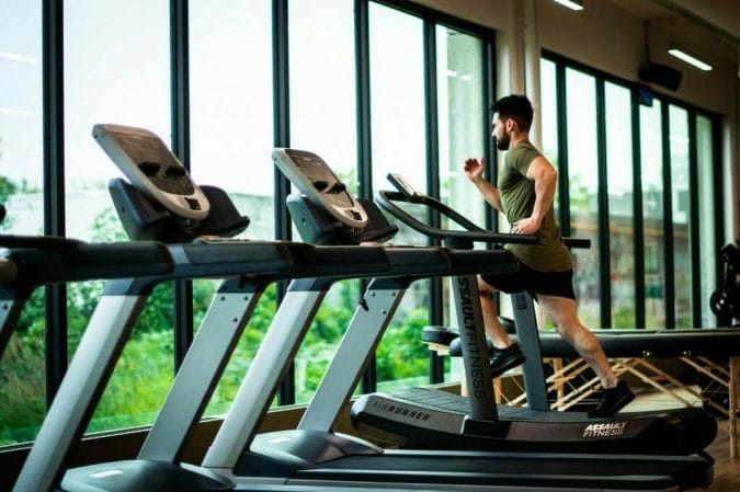  A man exercises on an exercise treadmill