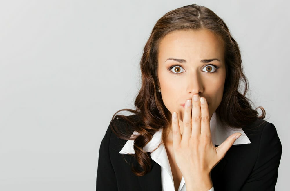  woman surprised by her bad breath