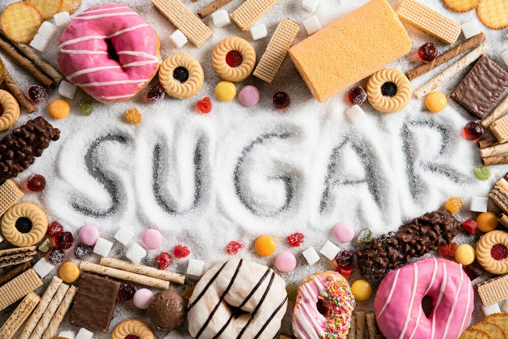 Spilled white sugar, all around sweets