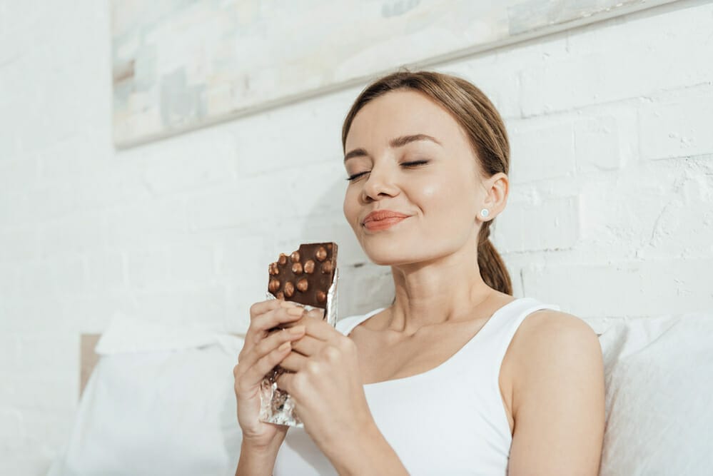 woman savors chocolate