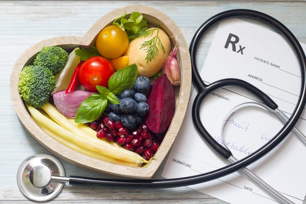 Healthy food in a heart-shaped salad bowl
